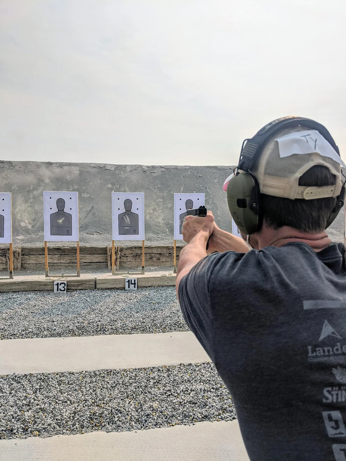 Shooter practicing handgun marksmanship on an outdoor firing range